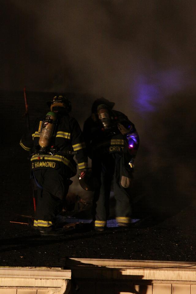 Mutual aid Katonah Old Deer Park Fire. L to R FF Hammond and Lt. Bancroft vent the roof